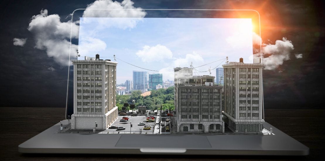 Case Studies of Civil Outsourcing 1 A laptop screen showcases a 3D scene of a miniature cityscape, illustrating case studies of civil outsourcing with buildings, cars, and trees blending seamlessly into the screen. The desktop background is a sunny sky with clouds.