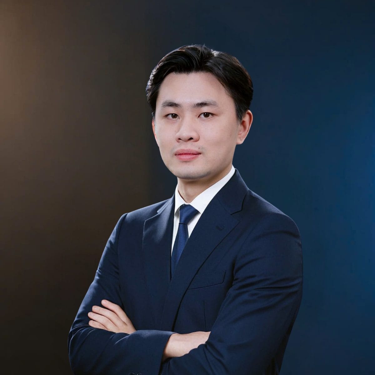 Civil Engineering Outsourcing A young man in a dark blue suit and tie stands with arms crossed, exuding confidence like a civil engineering outsourcing leader.